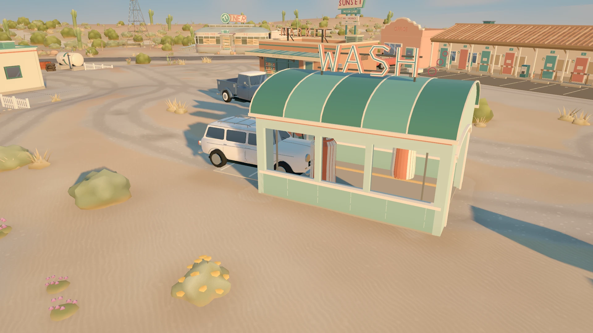 The rebuilt green car wash with a van at the tunnel.